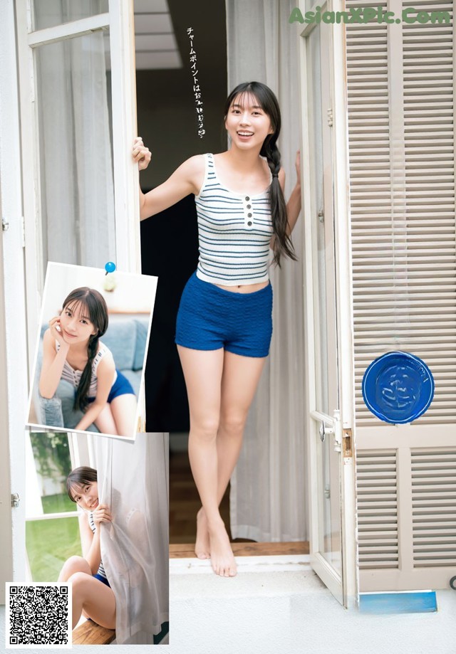 A woman in blue shorts and a striped shirt is standing in front of a door.