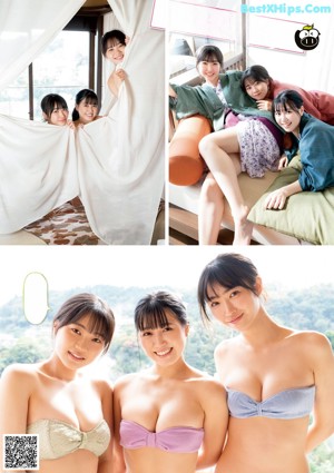 A group of three women sitting on top of a bed.