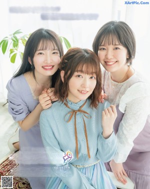 A group of young women sitting next to each other in a magazine.