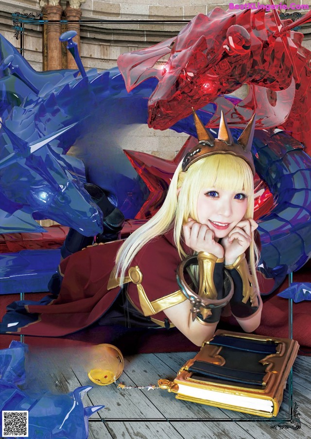 A woman in a red dress sitting next to a blue dragon.
