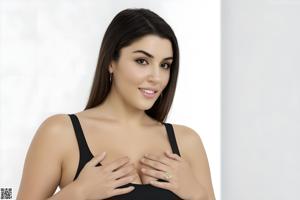 A woman in a red bikini posing for the camera.